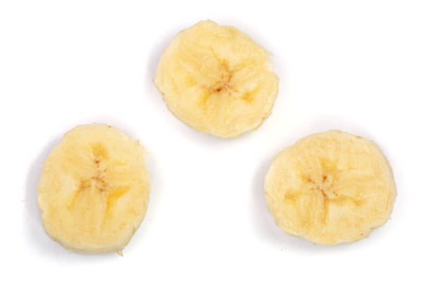 istock Banana slices isolated on a white background. Flat lay, top view 921335658