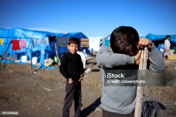 Sad Syrian Little Boy In Refugee Camp Stock Photo - Download Image Now - Refugee, Refugee Camp, Syria