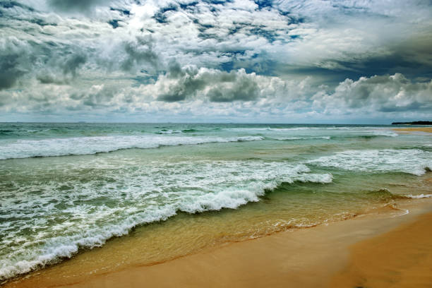 istock Dramatic dark sky and ocean waves in vintage style. 921341792