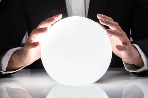 istock Businessman Hand On Crystal Ball 921343034