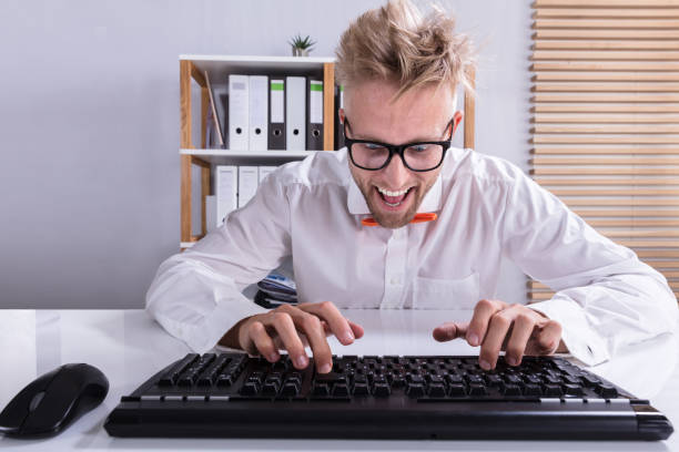 istock Businessman In Orange Bow Typing On Keyboard 921343226
