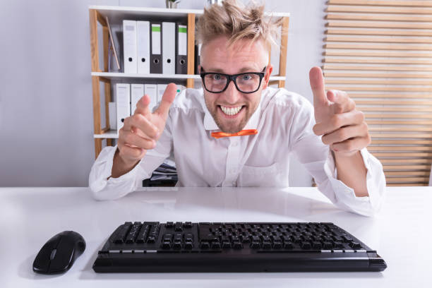 istock Keyboard In Front Of Pointing Businessman 921343242