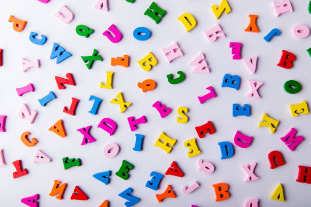 istock Scattered colorful wooden letters 921343360