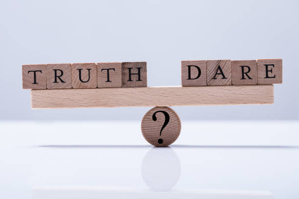 istock Truth And Dare Blocks Are Balanced On The Seesaw 921345506