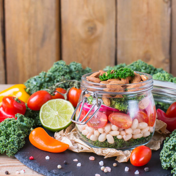 istock Healthy vegan salad in a mason jar with beans 921345942