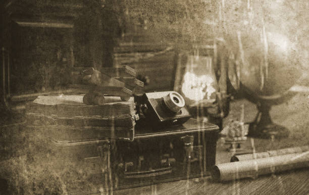 composition on a wooden floor vintage globe with old leather suitcase with objects for travel
