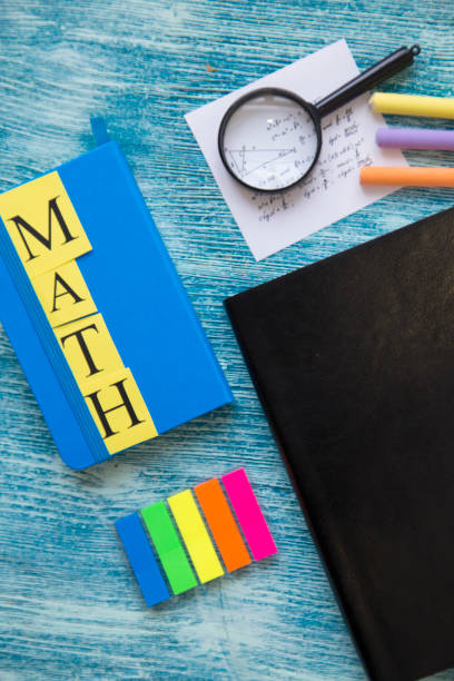 istock School supplies on a blue wooden background 921346286