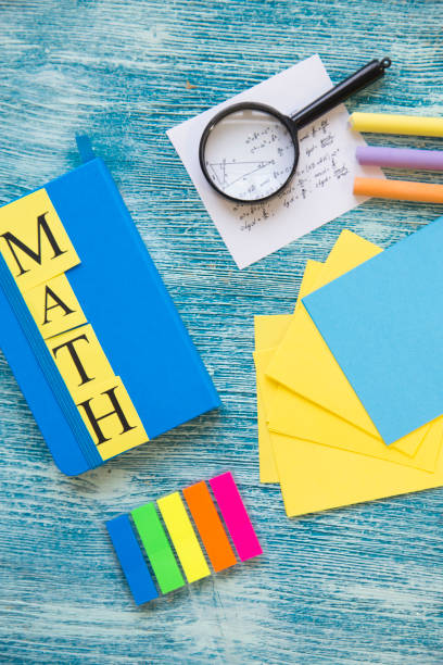 istock School supplies on a blue wooden background 921346364