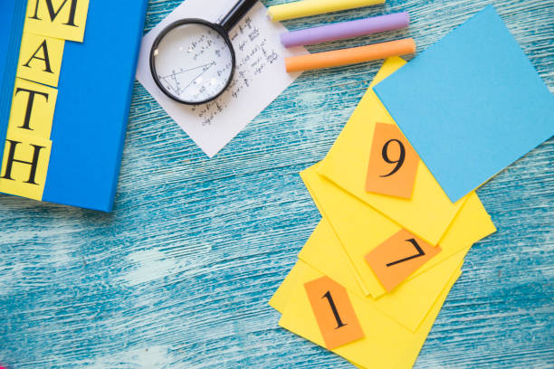 istock School supplies on a blue wooden background 921346546