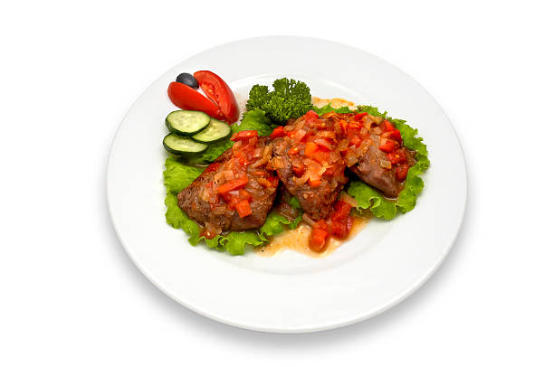 Grilled steak and vegetables on aged wooden table