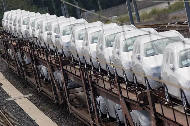 new 4x4 SUVs on rail transporter (shallow depth of field) - auto industry