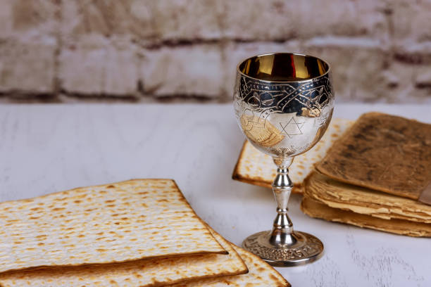 istock Matzo for Passover with metal tray and wine on table 921349926