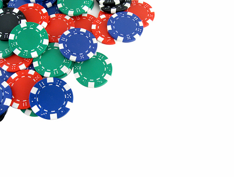 Poker chips on white background with space for text