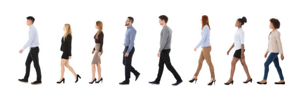 istock Male And Female College Students Walking In Row 921353636