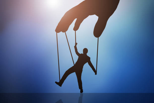 Businessman Saving Piggybank From Hammering Close-up Of Businessman's Hands Saving Piggybank From Hammering exploitation stock pictures, royalty-free photos & images