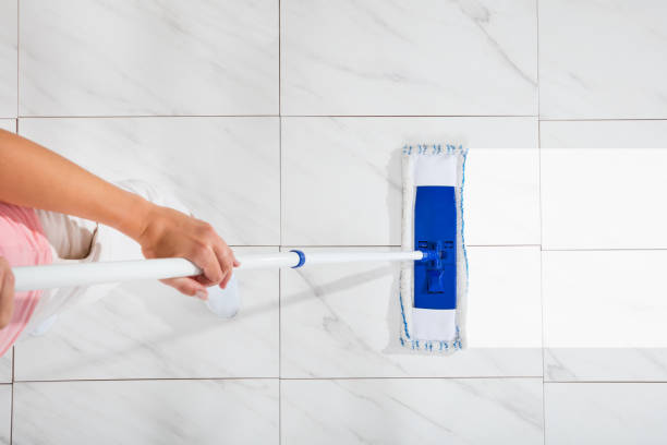 istock Woman Mopping The Floor 921353760