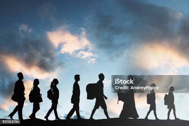 Refugees People With Luggage Walking In A Row Stock Photo - Download Image Now - Emigration and Immigration, Refugee, Immigrant