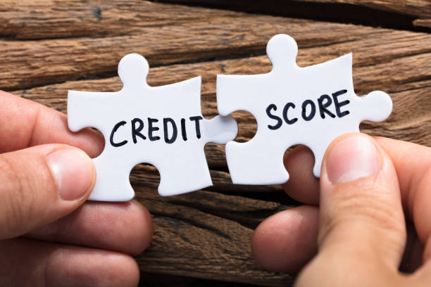 istock Hands Connecting Credit Score Jigsaw Pieces 921356570