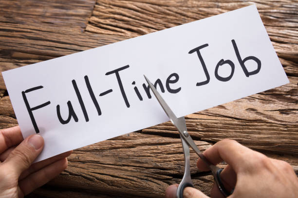 istock Hands Cutting Full-Time Job Words On Paper With Scissors 921356648
