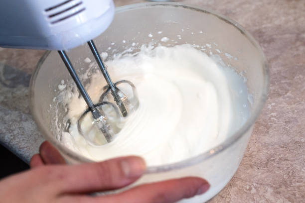istock Whisking pastry cream with a mixer 921359336