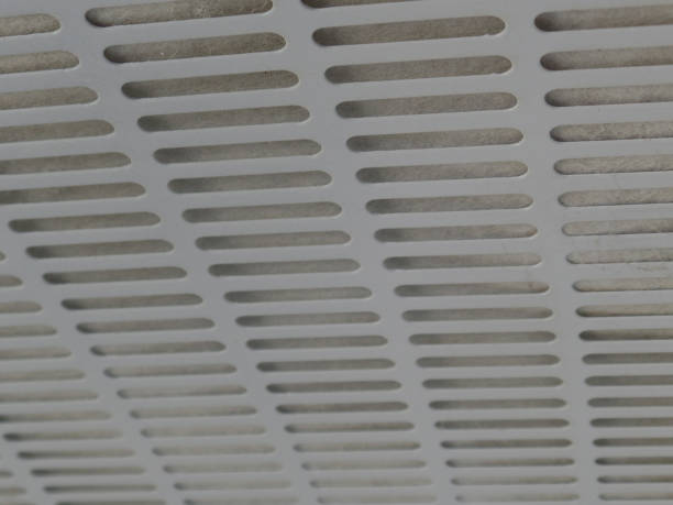 istock Texture of kitchen exhaust plates, white metal with holes 921359596