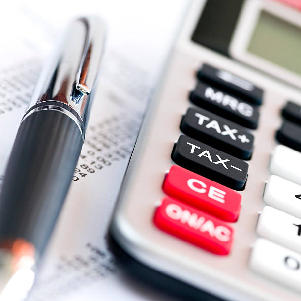 istock Tax calculator and pen 92136060