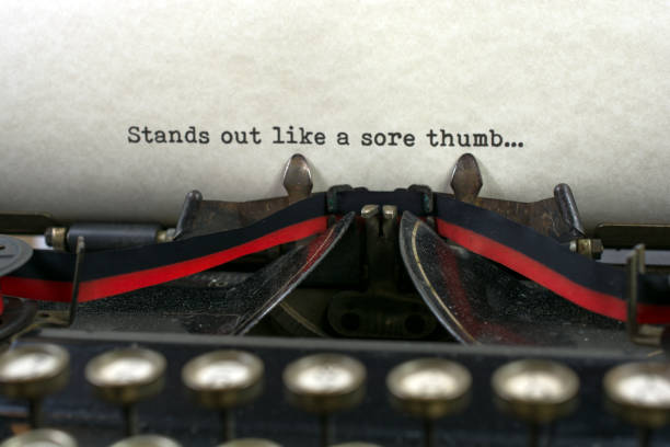 istock Antique typewriter with saying sore thumb 921370988