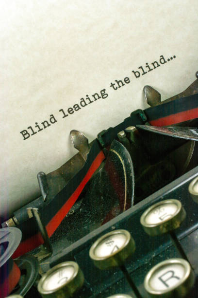 istock Antique typewriter with saying blind leading blind 921371236