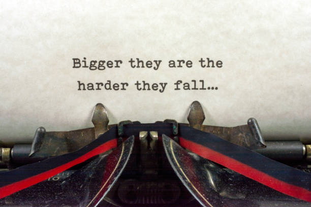 istock Antique typewriter with saying harder they fall 921371288