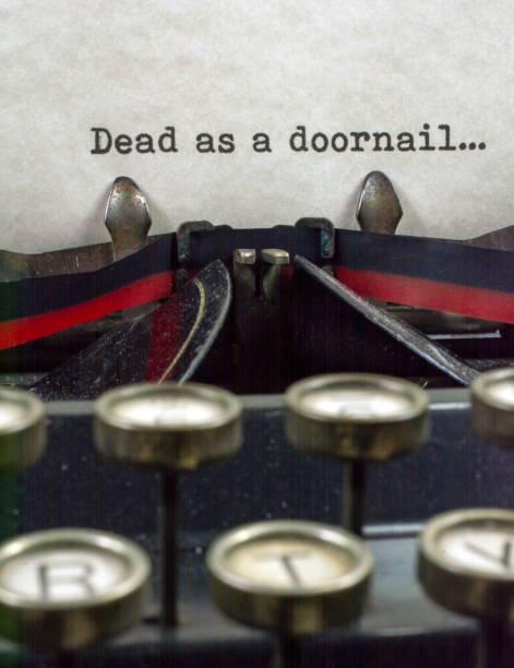 istock Antique typewriter with saying  dead as doornail 921377558