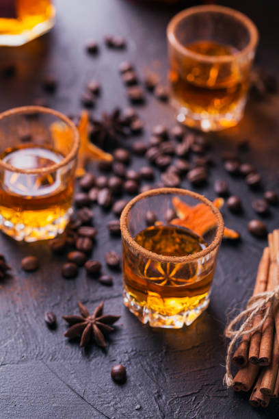 istock Whiskey, brandy or liquor, spices, anise stars, coffee beans, cinnamon sticks 921379672