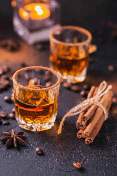 istock Whiskey, brandy or liquor, spices, anise stars, coffee beans, cinnamon sticks 921379708