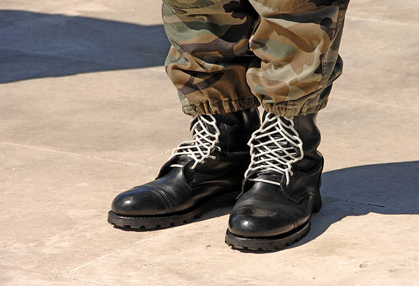 istock Feet of camouflaged soldier 92138130