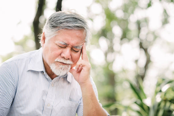 istock Asian senior man suffering from a headache 921405004
