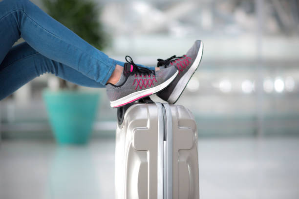 istock passenger leg on luggage waiting for departure 921411246