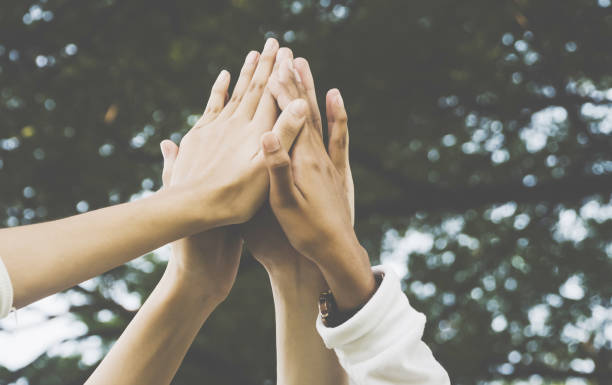 Team work and together concept, Hand of people high five for tag team Team work and together concept, Hand of people high five for tag team initiative photos stock pictures, royalty-free photos & images