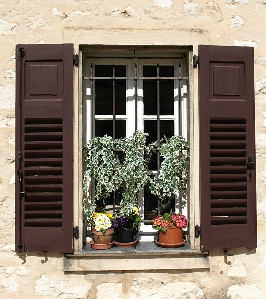 istock window in the wall with flower shutters steel security fence 92145852