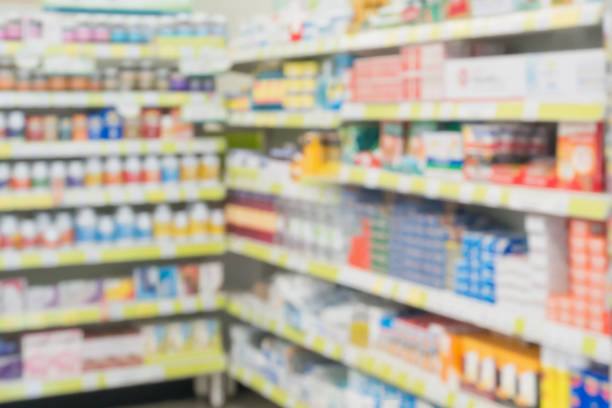 istock pharmacy drugstore shop interior blur background 921459318