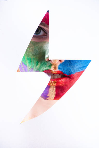 istock Beautiful female eye looking through the paper hole 921464636