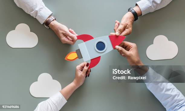 Business People With Startup Rocket Stock Photo - Download Image Now - New Business, Rocketship, Teamwork