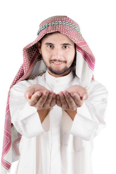 istock Arabian businessman open hand holding something 921475160