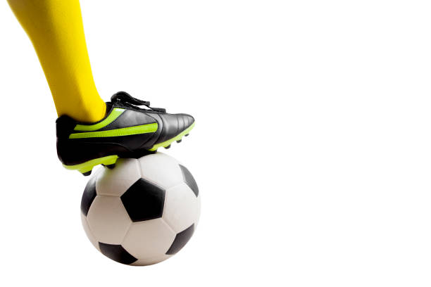 istock soccer player feet kicking soccer ball 921475294