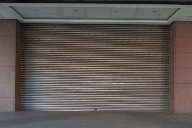 istock sidewalk by street wall & door 921480584