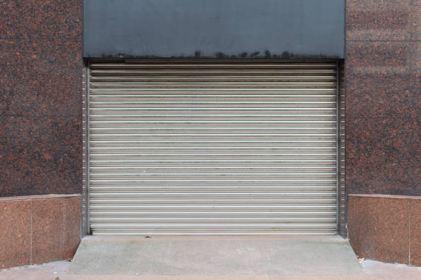 istock sidewalk by street wall & door 921480868