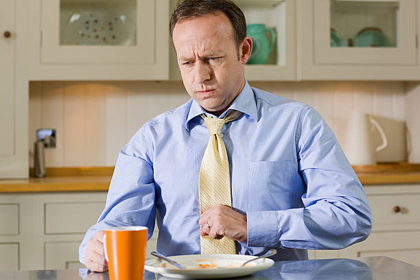 Man with indigestion  indigestion stock pictures, royalty-free photos & images