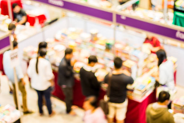 istock blurred people in book fair, chiangmai Thailand 921488796