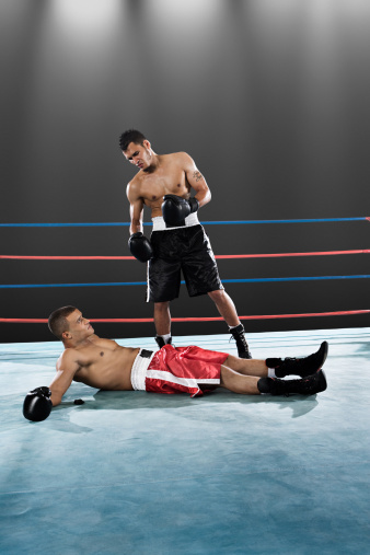 Portrait Of Man On Boxing Ring. Sexy Asian Sportsman With Strong, Healthy, Muscular Body At Fitness Center. Boxer With Elastic Tapes On Wrists Having Break After Training At Gym.