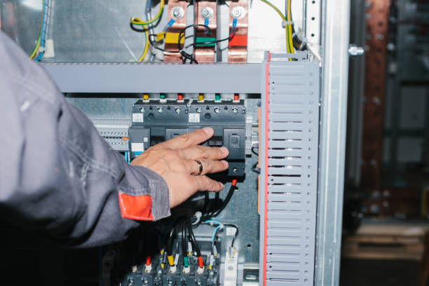 istock Electrician specialist checking low-voltage cabinet equipment 921491362