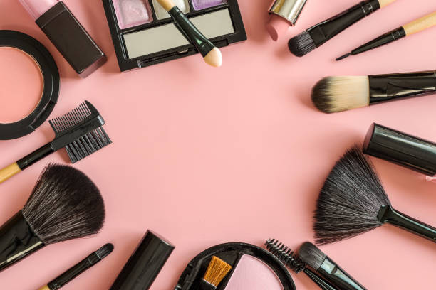 istock Set of make up brushes and cosmetics on pink background 921493922