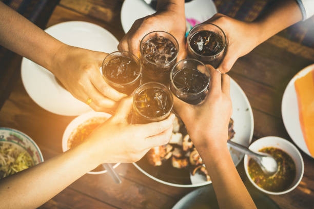 istock people are eating food ,drinking beverage together in party 921498084